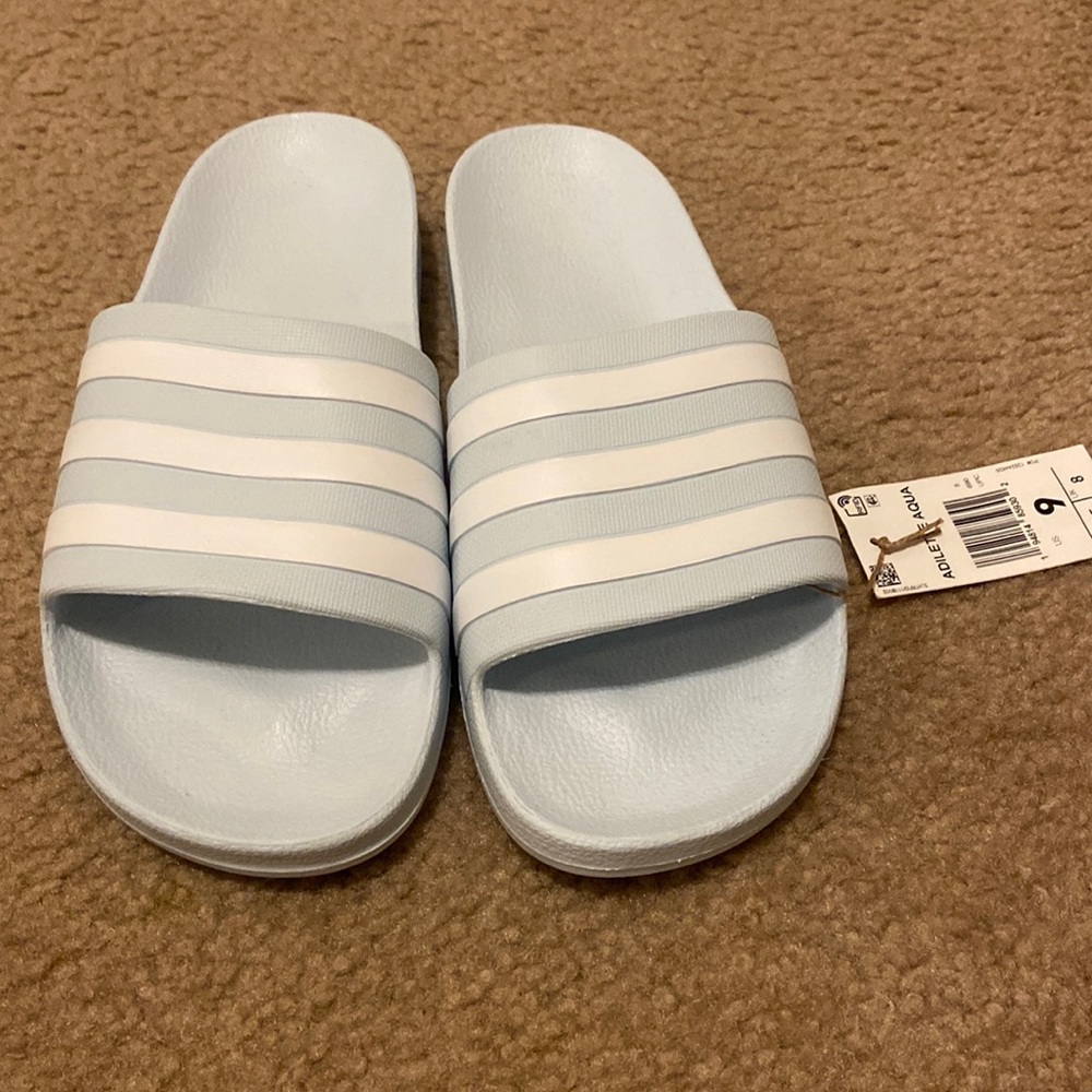 Adidas Women’s Adilette Slides in color Aqua